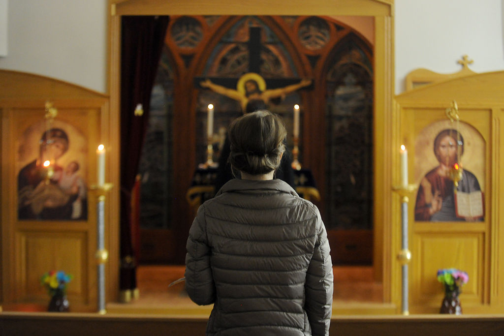 Kahlee Andresen prays before the altar